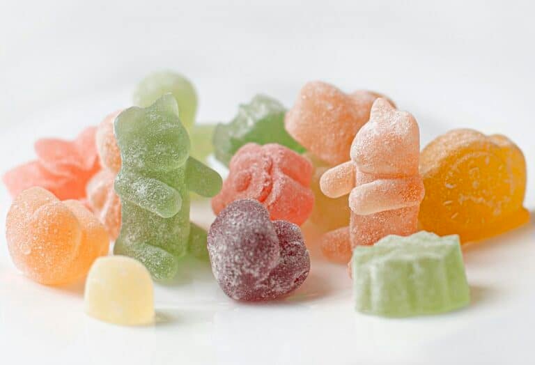 Assorted fruit gummies on a white plate