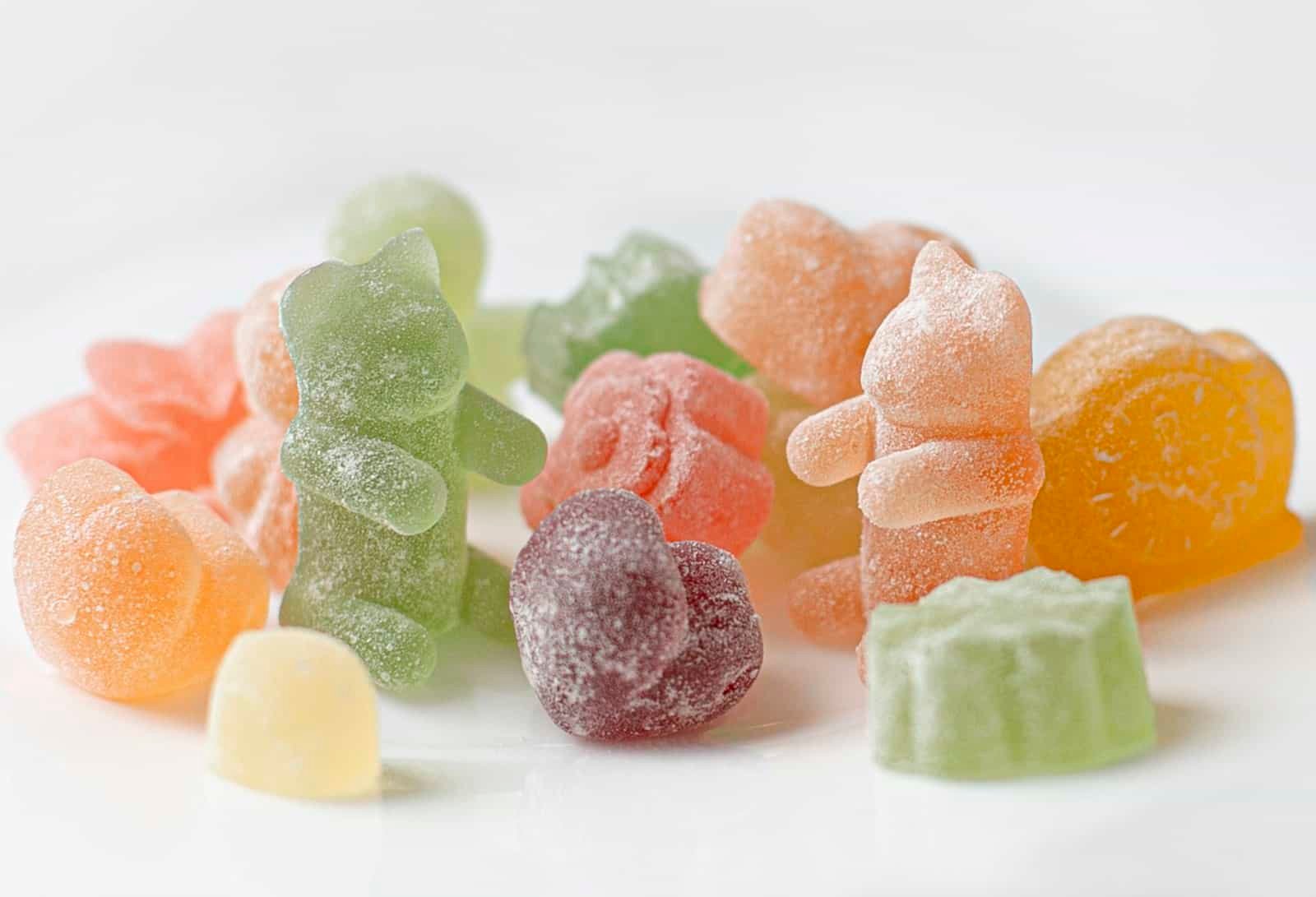 Assorted fruit gummies on a white plate