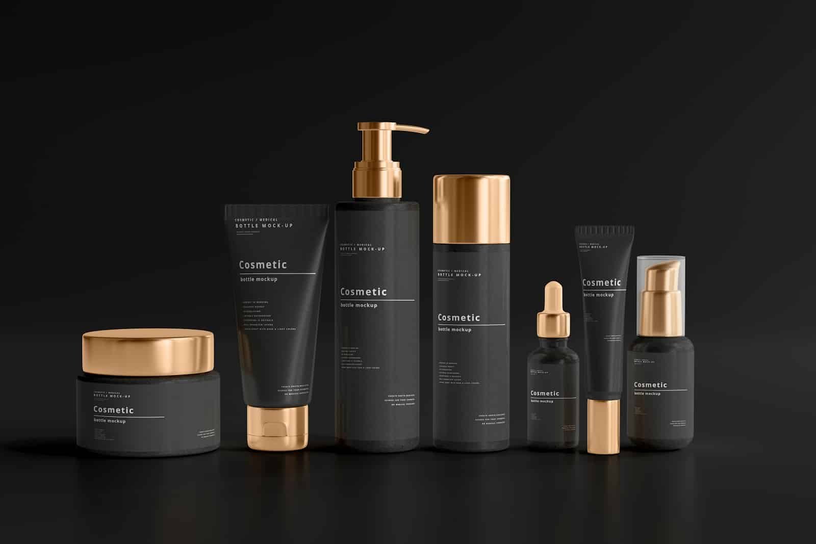 Black and gold skincare bottles and jars on a black surface