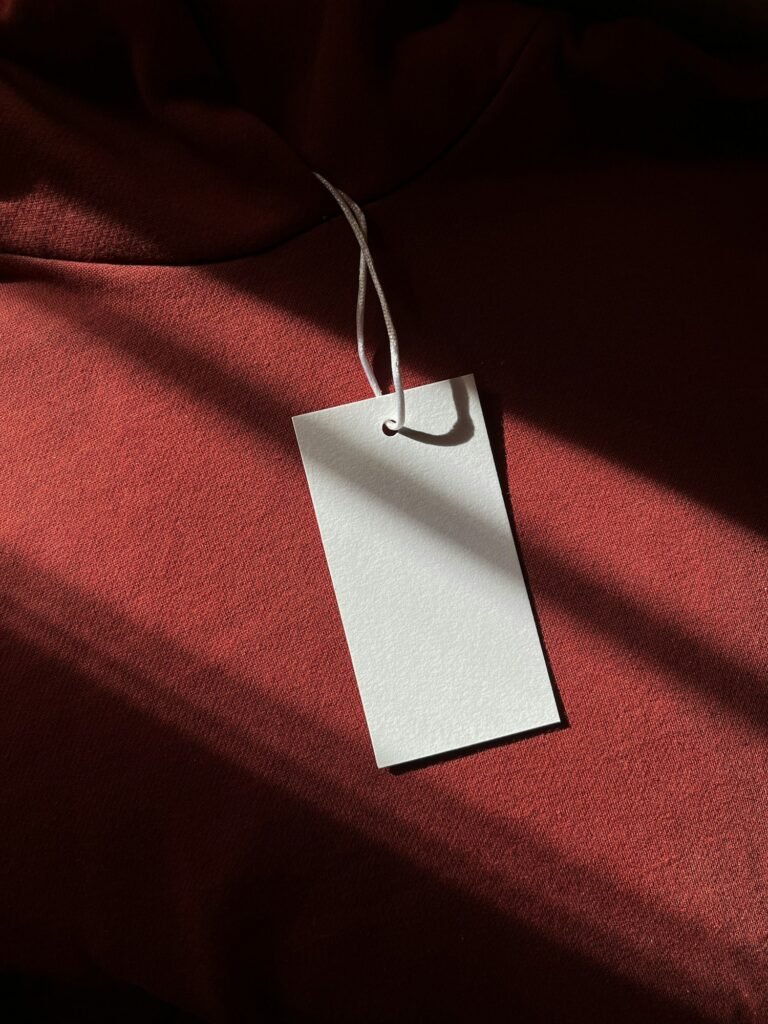 Blank paper hang tag on red fabric