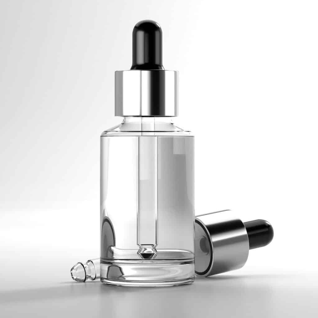 Clear glass dropper bottle with a silver cap
