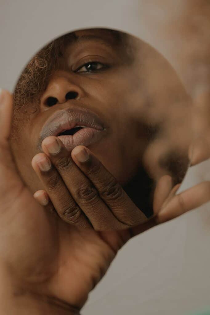 Close-up of a man touching his face