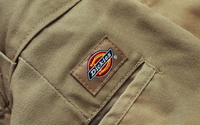 Close-up of khaki Dickies work pants with the logo patch on the pocket