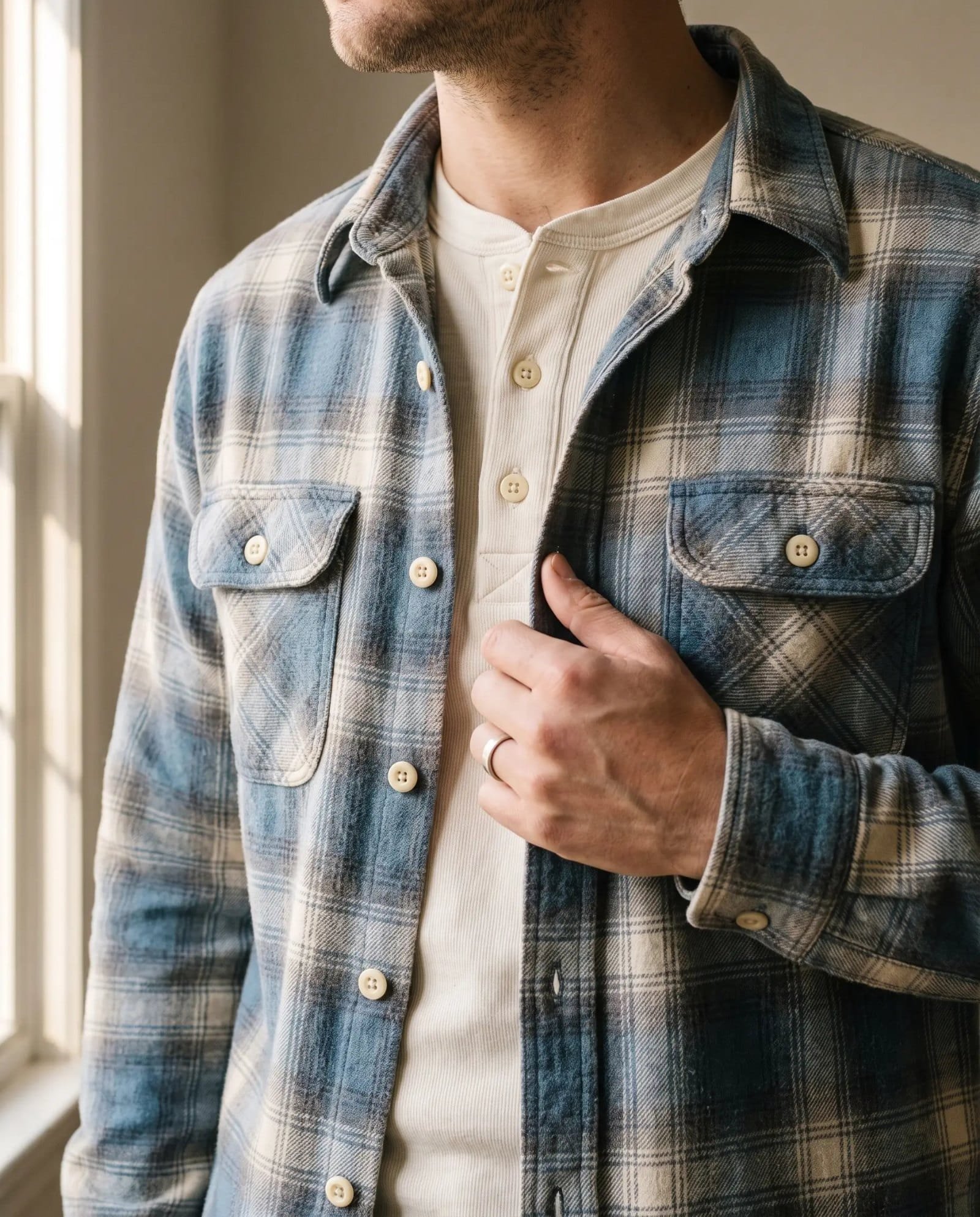 Close-up of the Wythe washed flannel workshirt in Glacier Plaid over a natural henley