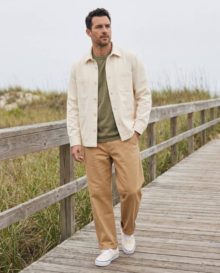 Man wearing the Corridor Misha overshirt in Natural, Corridor garment dye tee in olive, Corridor wide twill pant in tan