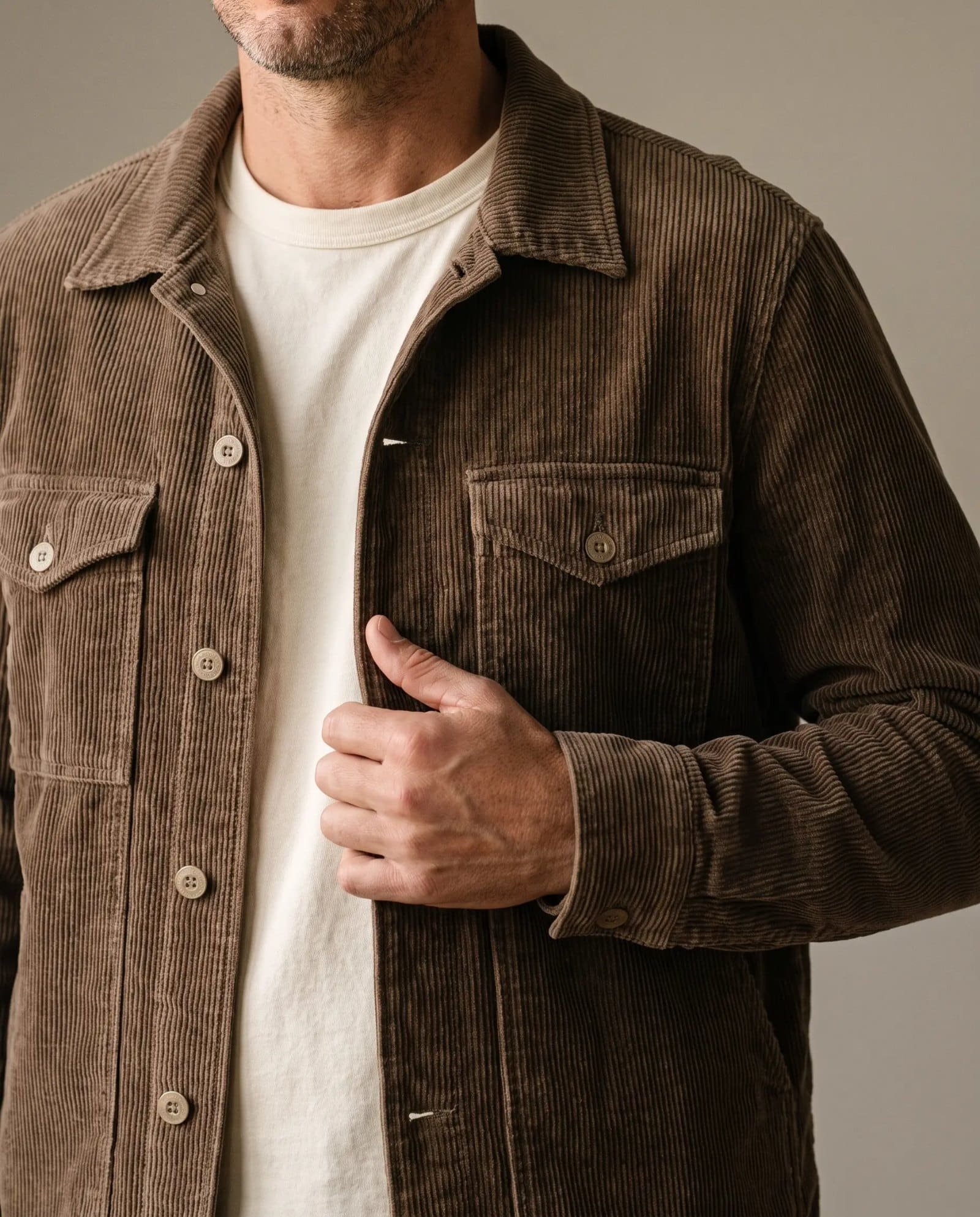 Close-up of the Save Khaki corduroy trucker jacket showing the wale, flap pockets and buttons