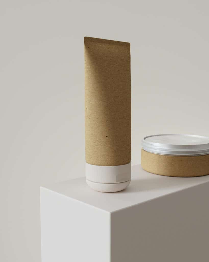 Kraft paper tube and matching jar on a white block