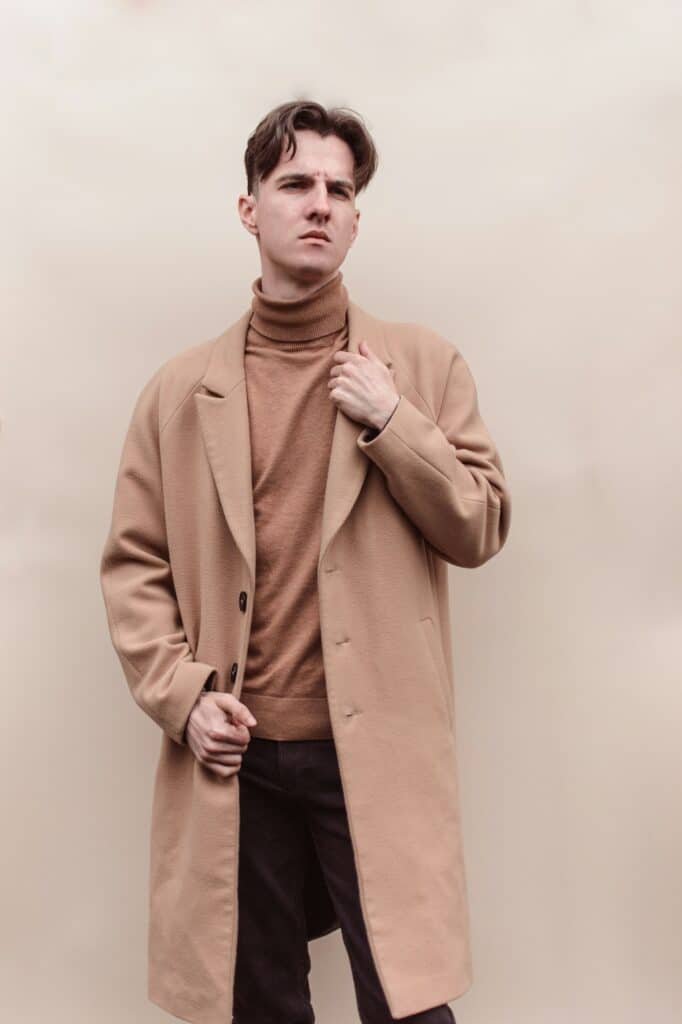Man in a camel coat over a camel turtleneck