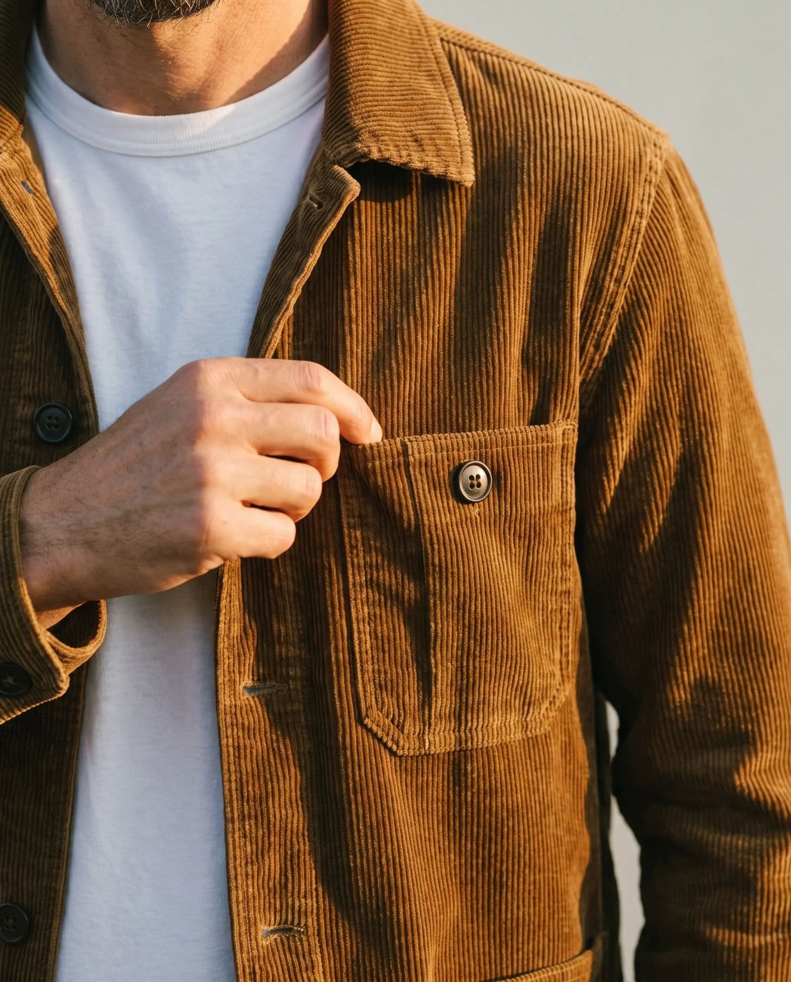 Close-up of the Taylor Stitch Ojai jacket chest pocket in bourbon corduroy