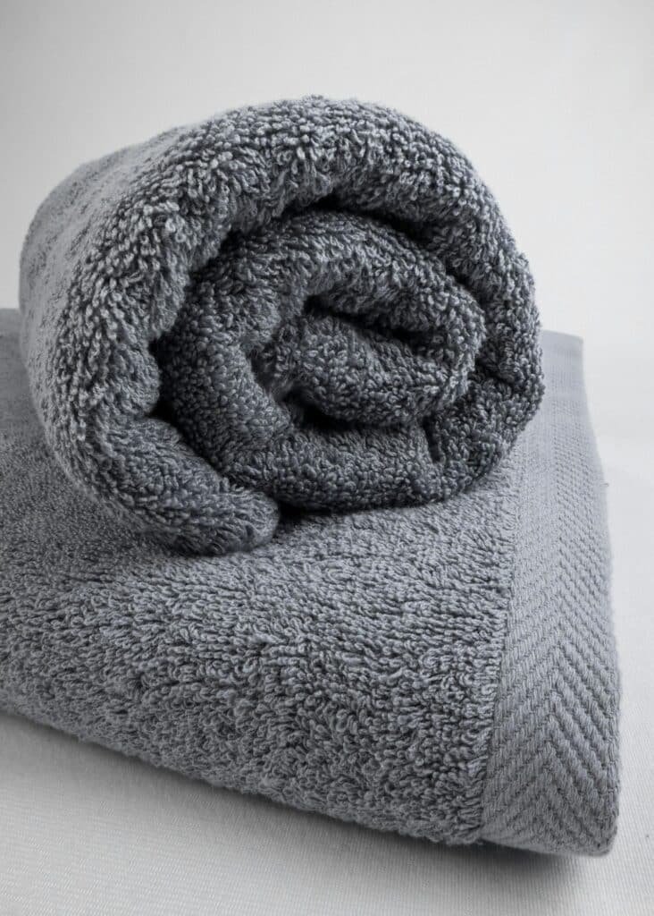Rolled gray bath towel